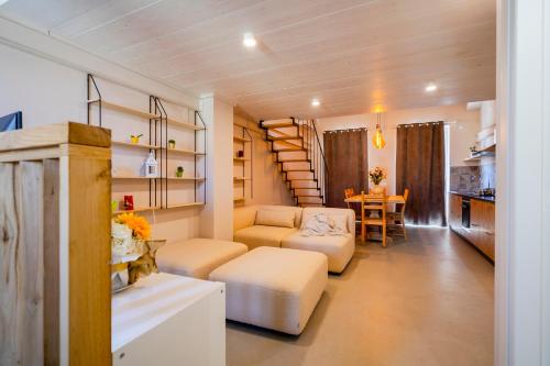 a living room with a couch and a table at Loft di design Wi-Fi e Clima in Porto SantʼElpidio