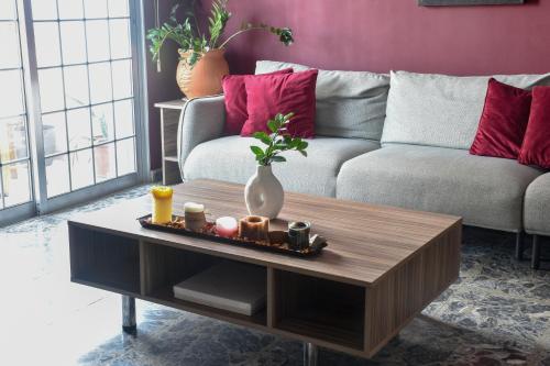 a living room with a couch and a coffee table at The Family House in Larnaca