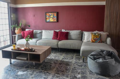 a living room with a couch and a table at The Family House in Larnaca