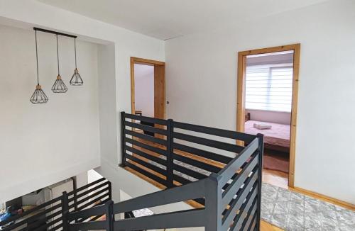 a room with a wooden bench and a mirror at Villa E&M in Srebrenik