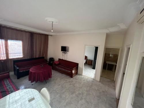 a living room with a couch and a table at Les sœurs in Tunis