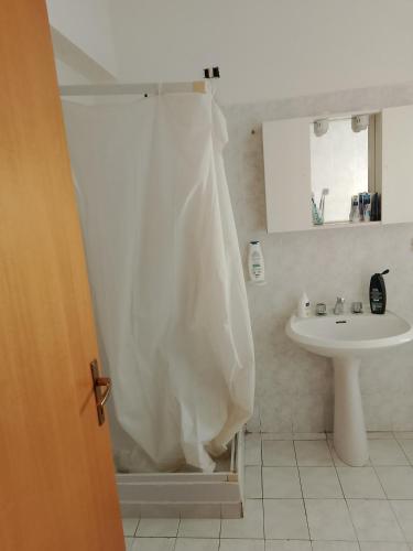 a bathroom with a shower curtain and a sink at Vacanze MARE Vasto in Vasto