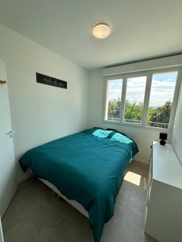 Postel nebo postele na pokoji v ubytování Béligneux Horizons - 4 Personnes