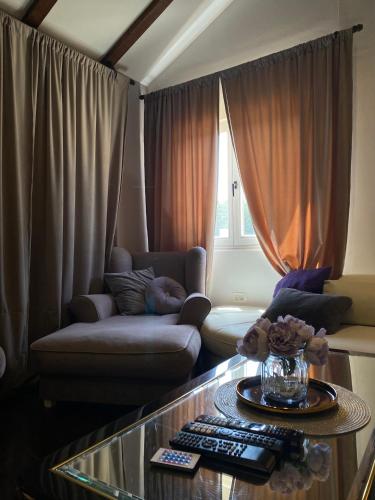 a living room with a couch and a glass table at Kuća sa bazenom Sarajevo - Lavanda Estate in Sarajevo
