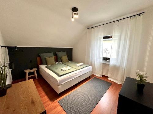 Ένα ή περισσότερα κρεβάτια σε δωμάτιο στο Home&Living - Casa Green