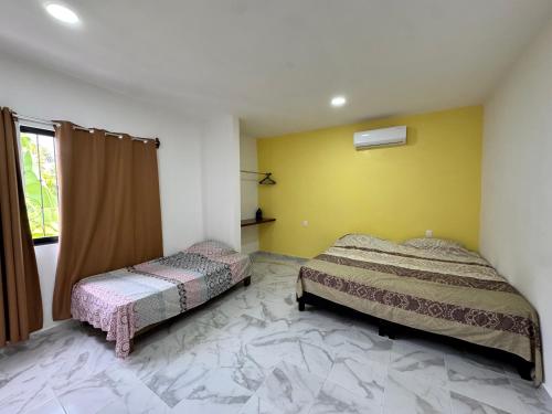 Ένα ή περισσότερα κρεβάτια σε δωμάτιο στο Casa Vainilla