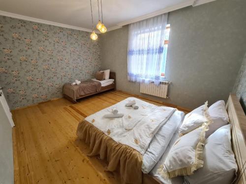a bedroom with a large bed in a room at Big villa ISK in Gabala