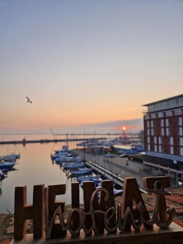a view of a harbor with boats in the water at Ferienwohnung Hafenpanorama Speicherresidenz Barth 4 5 in Barth
