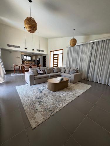 a living room with a couch and a coffee table at Private Somabay Villa with Pool in Hurghada