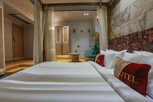a bedroom with a large bed in a room at Aceotel Select Aria, Bhopal -A Luxury Boutique Hotel in Bhopal