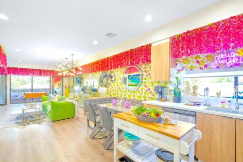 a kitchen and dining room with a colorful wall at H- Fab Family 5BD 4,5BA NoHo Escape Near Universal with Games, Deck, Parking in North Hollywood
