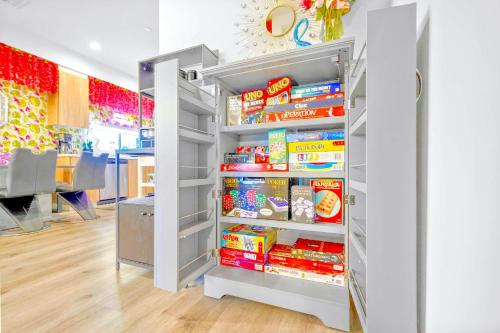 a refrigerator filled with food in a room at H- Fab Family 5BD 4,5BA NoHo Escape Near Universal with Games, Deck, Parking in North Hollywood
