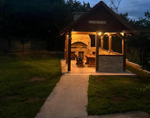 a gazebo in a yard at night at White house Sarajevo in Sarajevo