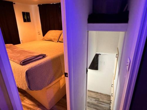 a small bedroom with a bed and a bunk bed at b3 Couples Therapy Yacht in La Crosse