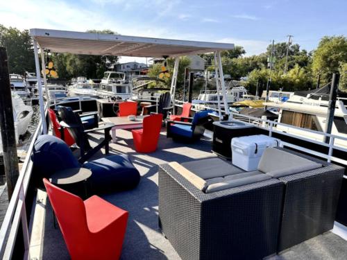 a dock with chairs and tables and chairs on a boat at b3 Couples Therapy Yacht in La Crosse