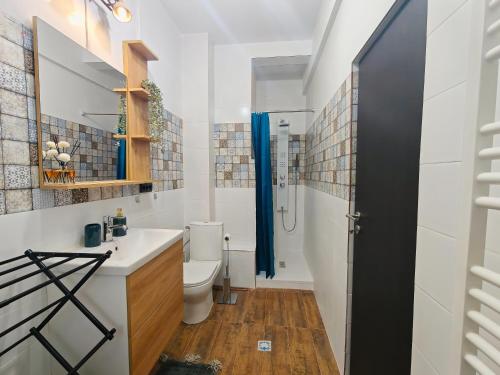 a bathroom with a toilet and a sink at Botev Design Apartments - Walk to Old Town - Pumo Properties in Bucharest