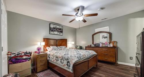 a bedroom with a bed and a ceiling fan at Cozy hill in Rock Hill
