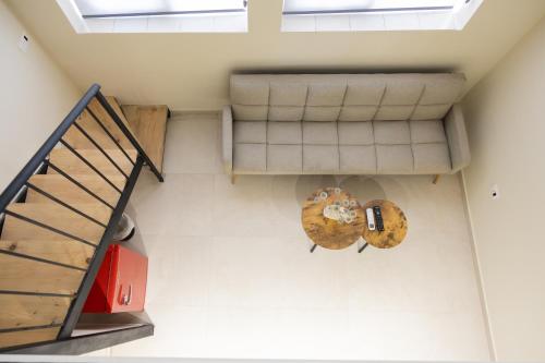 an overhead view of a room with two donuts on the floor at Hana Apart-hotel in Sarandë