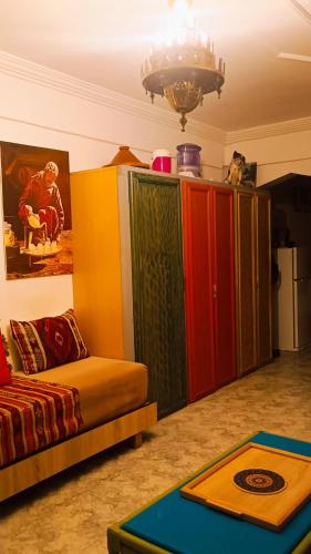 a living room with colorful cabinets and a couch at Riad SULTANA lateral seaview in Saidia 