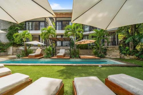 an exterior view of a house with a swimming pool at L'Avventura in Tamarindo