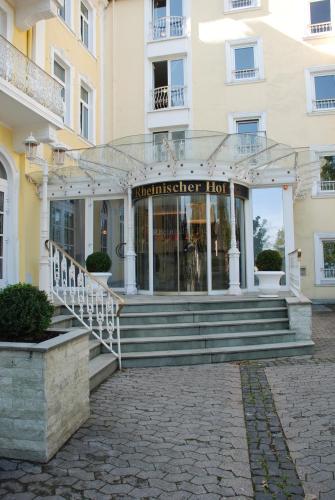 a building with a staircase in front of a building at Hotel Rheinischer Hof Bad Soden in Bad Soden am Taunus