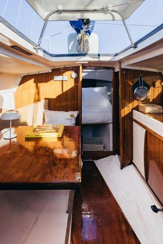 a wooden table in the back of a boat at Seaside Retreat with Postcard Views in Cascais