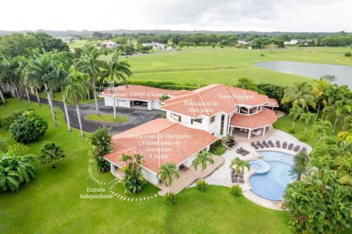 an aerial view of a house with a swimming pool at Palmarenas Pacific Retreat in El Chirú