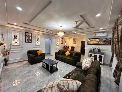 a large living room with couches and a fireplace at Arek Condos Accra in Sotuom