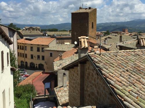 an aerial view of a city with roofs at Hotel Duomo in Orvieto