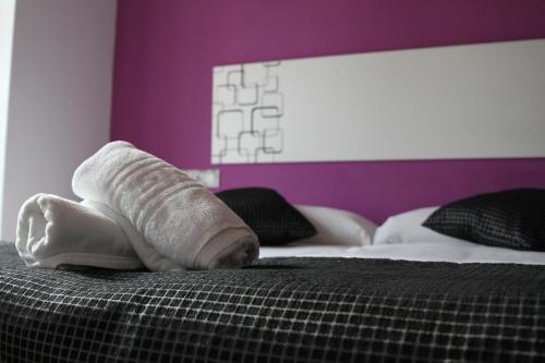 Ένα ή περισσότερα κρεβάτια σε δωμάτιο στο Apartamentos Tito San Agustin