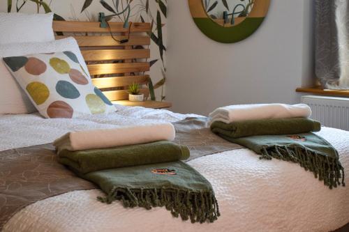 a bed with three pillows on top of it at Ciné Mirabelle 