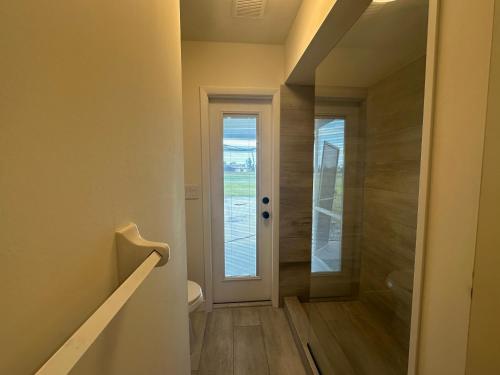 a hallway with a door leading to a bathroom at Beautiful 2-bedroom, 2-bathroom In Rotonda West in Rotonda West