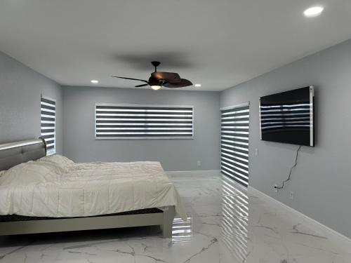 a bedroom with a bed and a ceiling fan at Gulf Cove Community in Port Charlotte