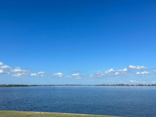 a large body of water with a blue sky at Gulf Cove Community in Port Charlotte