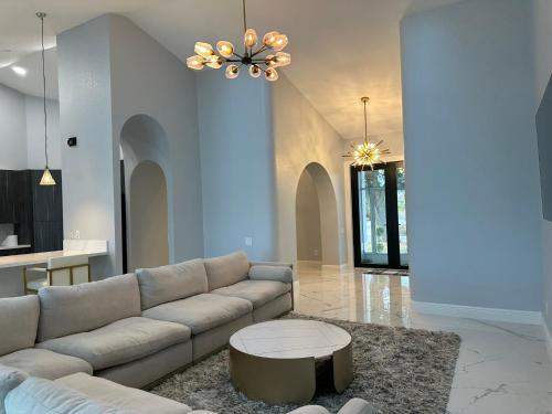 a living room with a couch and a table at Gulf Cove Community in Port Charlotte