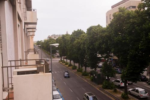 a view of a city street with cars on the road at B&B Liberty in Messina