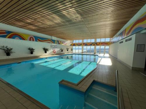 a large swimming pool in a building at Holiday apartment with 2 bedrooms in Zirkitz