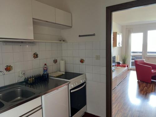 a kitchen with a sink and a stove top oven at Holiday apartment with 2 bedrooms in Zirkitz