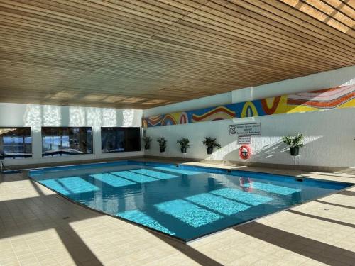 a large swimming pool in a building at Holiday apartment with 2 bedrooms in Zirkitz