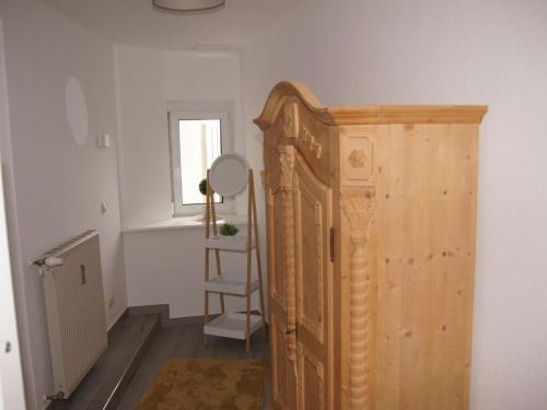 a room with a wooden bed and a window at Dream view Simonhöhe in Zirkitz