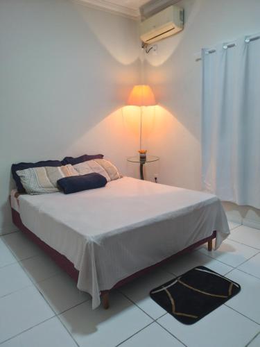 Giường trong phòng chung tại Apto próx de tudo com lazer e conforto COP30