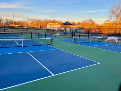 a group of tennis courts on a court at Dog-Friendly Oceanfront Getaway - Walk to Dining - Private Beach Access in Milford