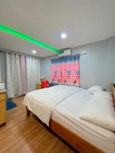 Katil atau katil-katil dalam bilik di Malapascua Island Dos Marias Tourist Inn