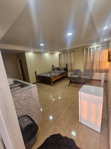 a living room with a couch and a table at Lion's Guest House in Warner in Mahaut