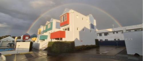 a rainbow over a building with a rainbow at 9 By the Clyde, Central Location in Batemans Bay in Batemans Bay