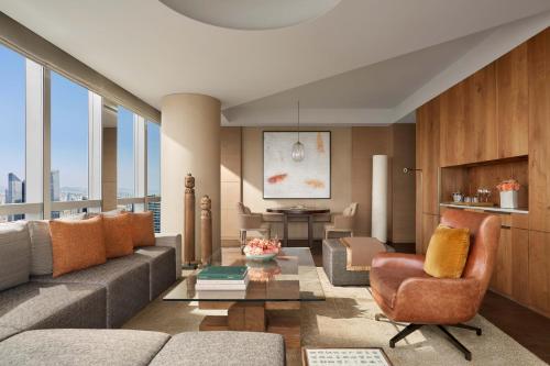 a living room with a couch and a table at Park Hyatt Guangzhou in Guangzhou