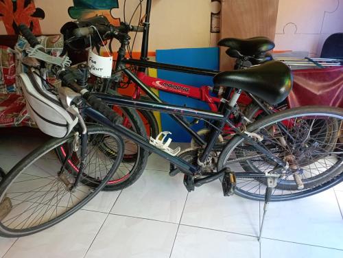 two bikes parked next to each other in a room at Karma Home Hostel in Phitsanulok