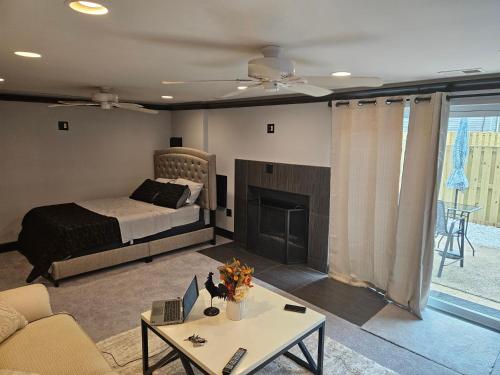 a living room with a bed and a fireplace at Solo travelers and couple in Sterling