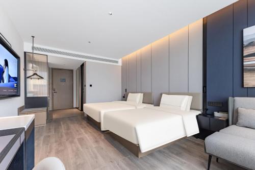 Una cama o camas en una habitación de Atour Hotel Hangzhou Aeon Mall Liangzhu Gudun Road