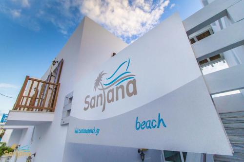 a sign on the side of a building at Santana Beach in Agia Anna Naxos